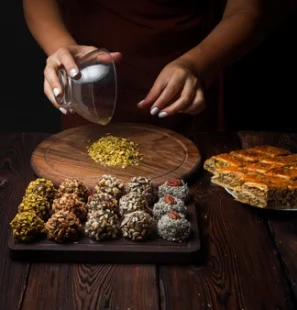 side-view-sweets-handmade-handmade-sweets-from-nuts-dried-fruits-honey-horizontal_176474-2517